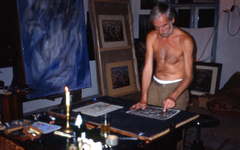 Hans Praetterhoffer working at a studio table with a visitor