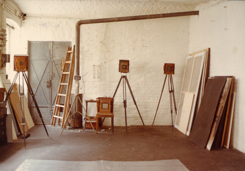 Studio wall with canvases, easels and equipment