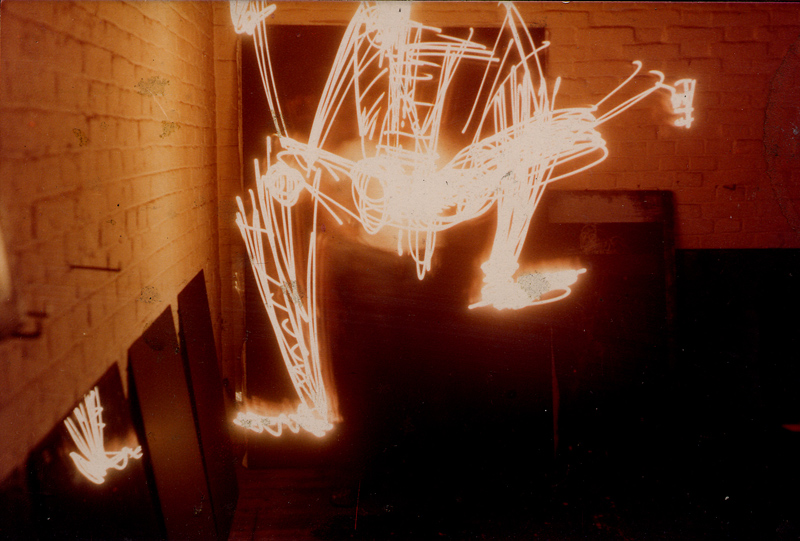 Long-exposure light drawing of a moving figure