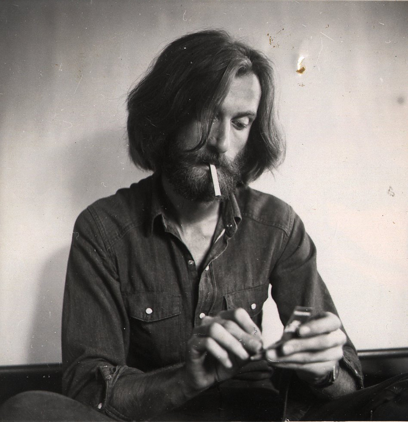 Black-and-white portrait of Hans Praetterhoffer working with his hands